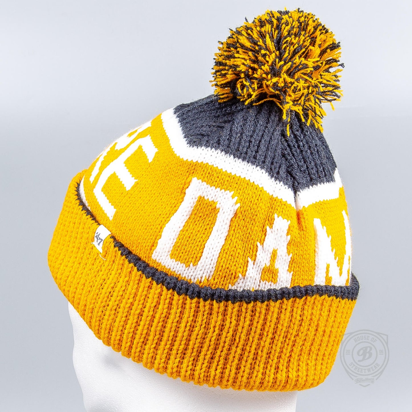 Zimná čiapka s brmbolcom 47 Brand NCAA Notre Dame Standalon Navy Calgary Cuff Knit žltá