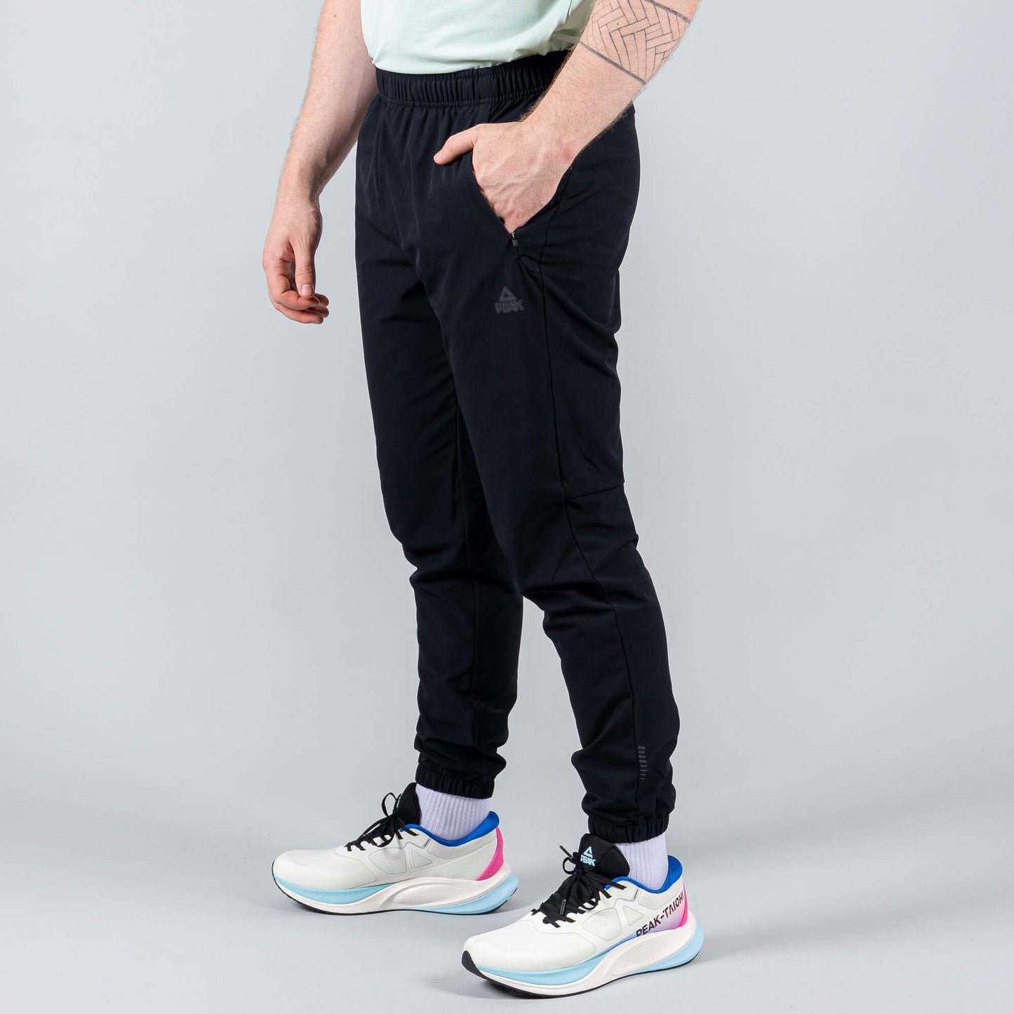 Bežecké Nohavice Peak (Woven Fleece Pants) Black