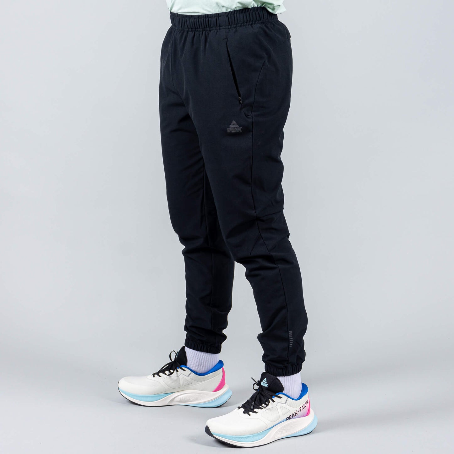 Bežecké Nohavice Peak (Woven Fleece Pants) Black