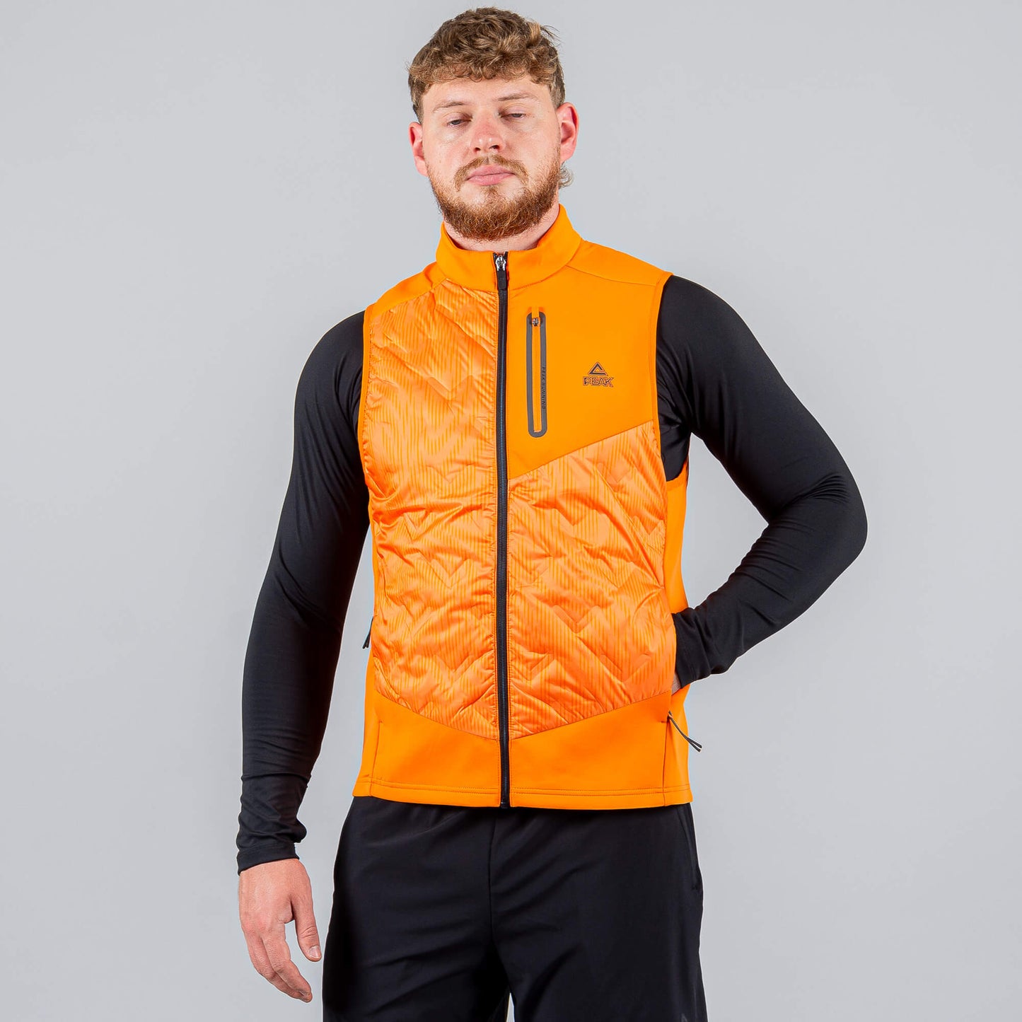 Bežecká Páperová Vesta Peak Down Waistcoat Orange