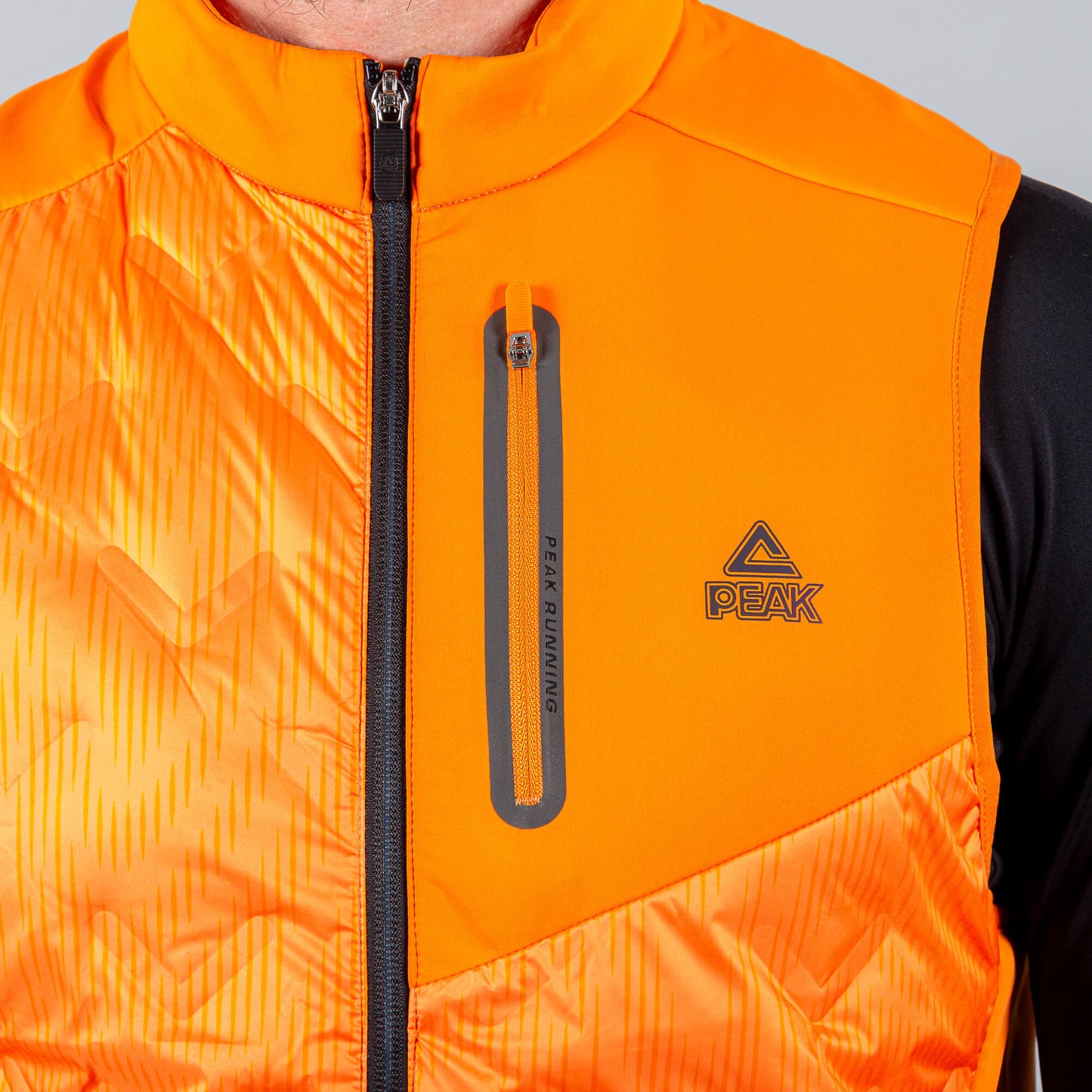 Bežecká Páperová Vesta Peak Down Waistcoat Orange