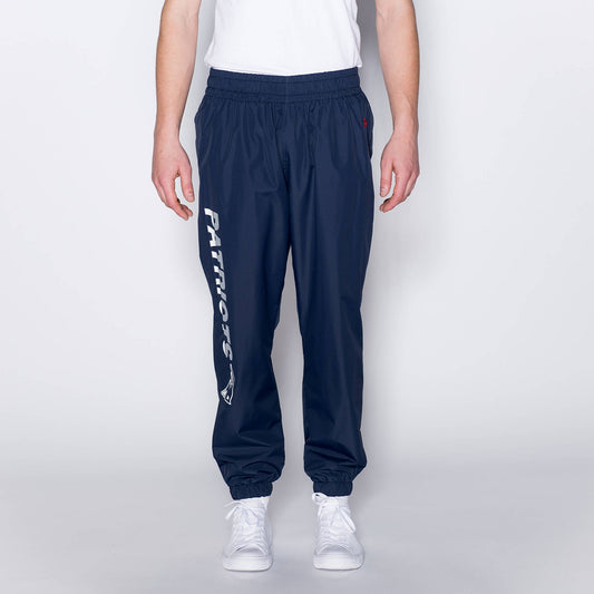 Šuštiakové nohavice New Era NFL Wordmark 2 New England Patriots tmavomodré